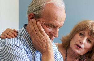 Asbestos woman comforting husband