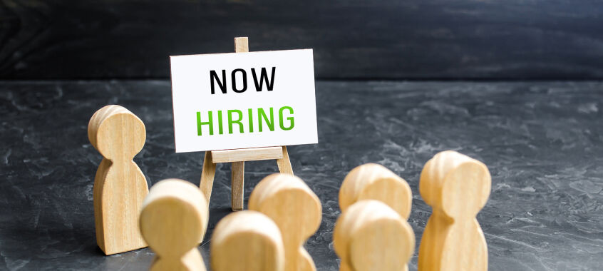 bigstock A Man With A Now Hiring Sign A 441288767