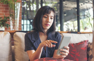 bigstock Asian Woman Holding Smartphone 469693033