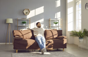 bigstock Happy Young Man Sitting On A C 470213785