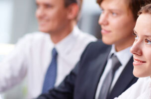 Three business people listening 