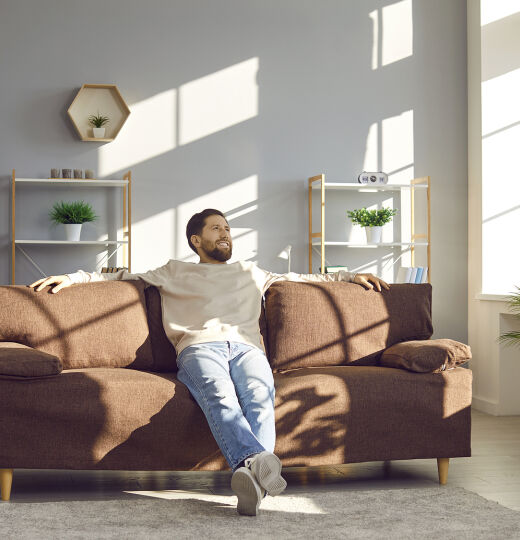 bigstock Happy Young Man Sitting On A C 470213785