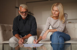bigstock Mature Couple Signing Divorce 446792588