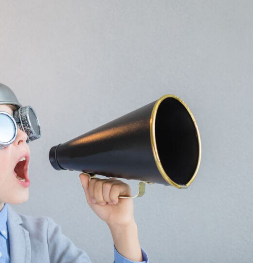 Child with lightbulb and megaphone