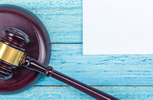 Gavel on blue background   Dis Res