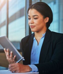 business woman reading newsletter