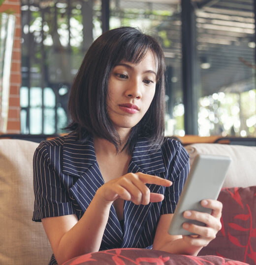 bigstock Asian Woman Holding Smartphone 469693033