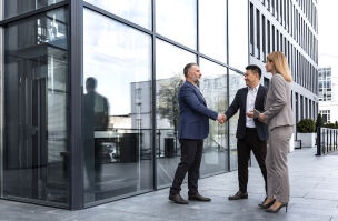 bigstock Meeting Of Three Successful Bu 460696459