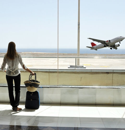 bigstock Girl at the airport window loo 26611379