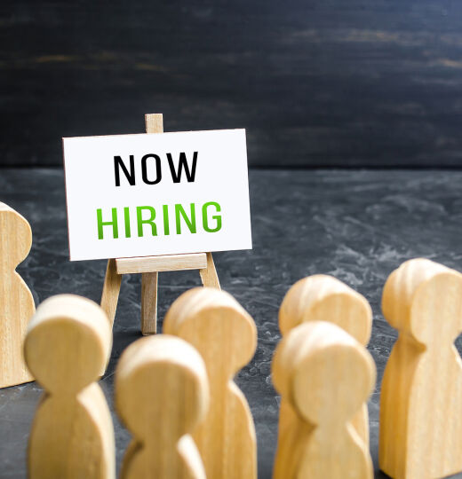 bigstock A Man With A Now Hiring Sign A 441288767