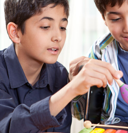 Two boys building and playing   iStock 184327664