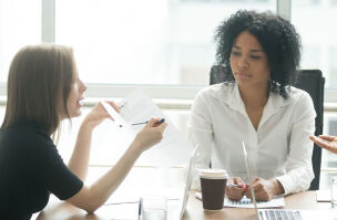 bigstock Diverse Employees Arguing Duri 240333181