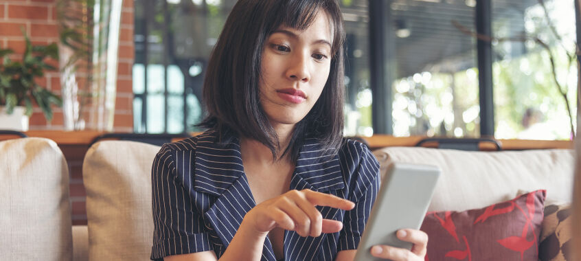 bigstock Asian Woman Holding Smartphone 469693033