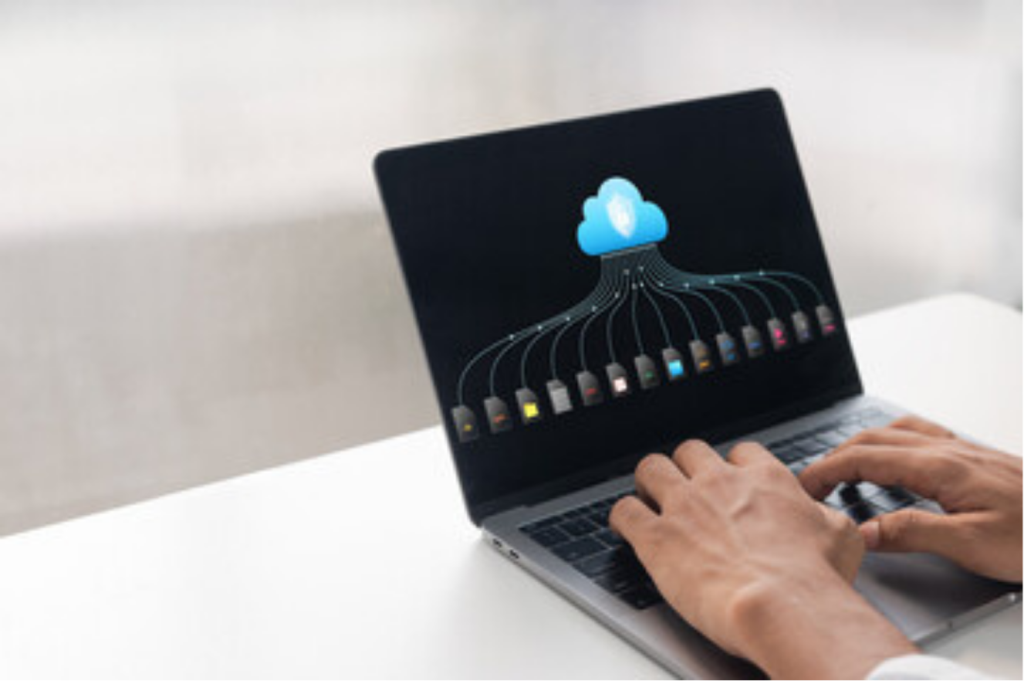 Person using cloud software on laptop