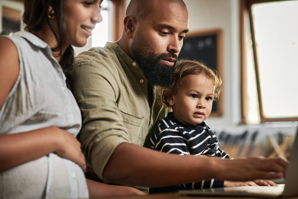 Family with young children looking at claims