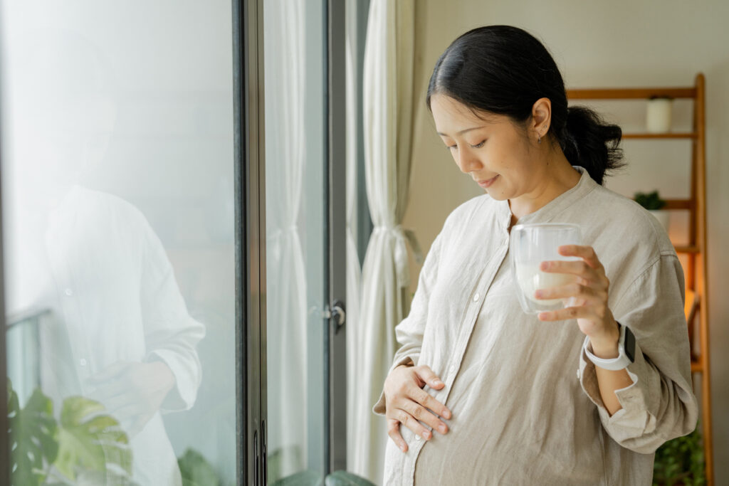 pregnant woman drinking water