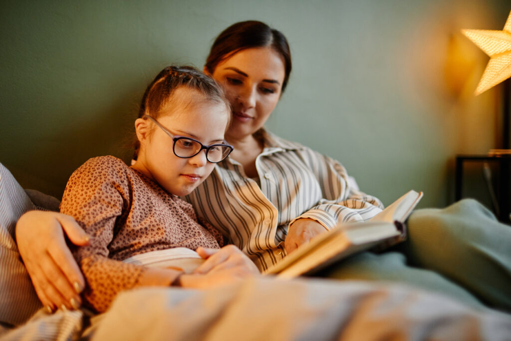 child and mum reading book