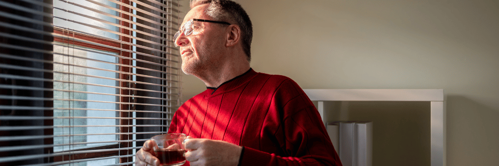 elderly man having coffee
