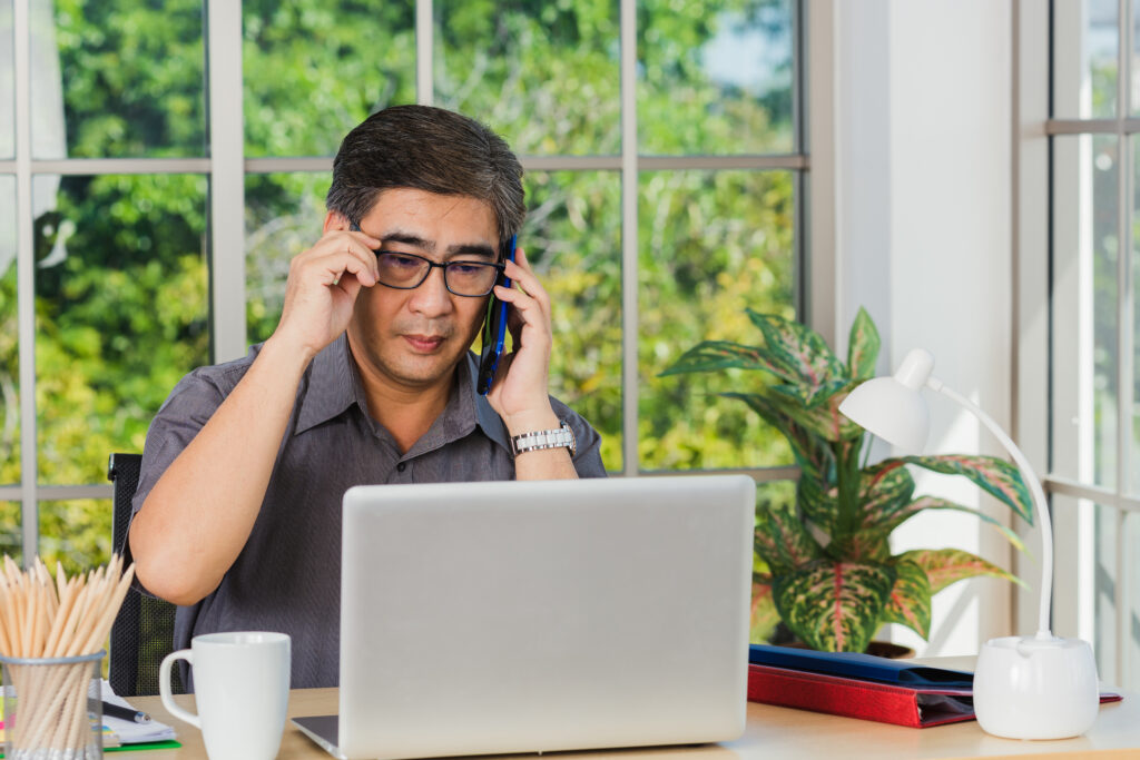 Middle aged man talking on the phone