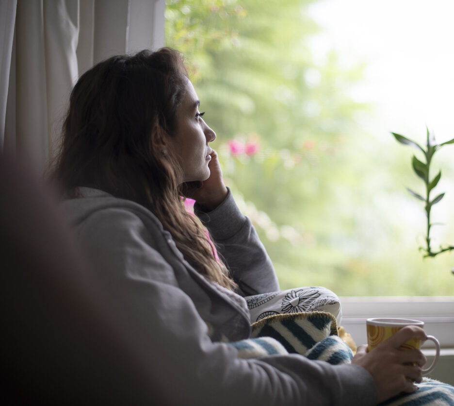 woman thinking looking out of window