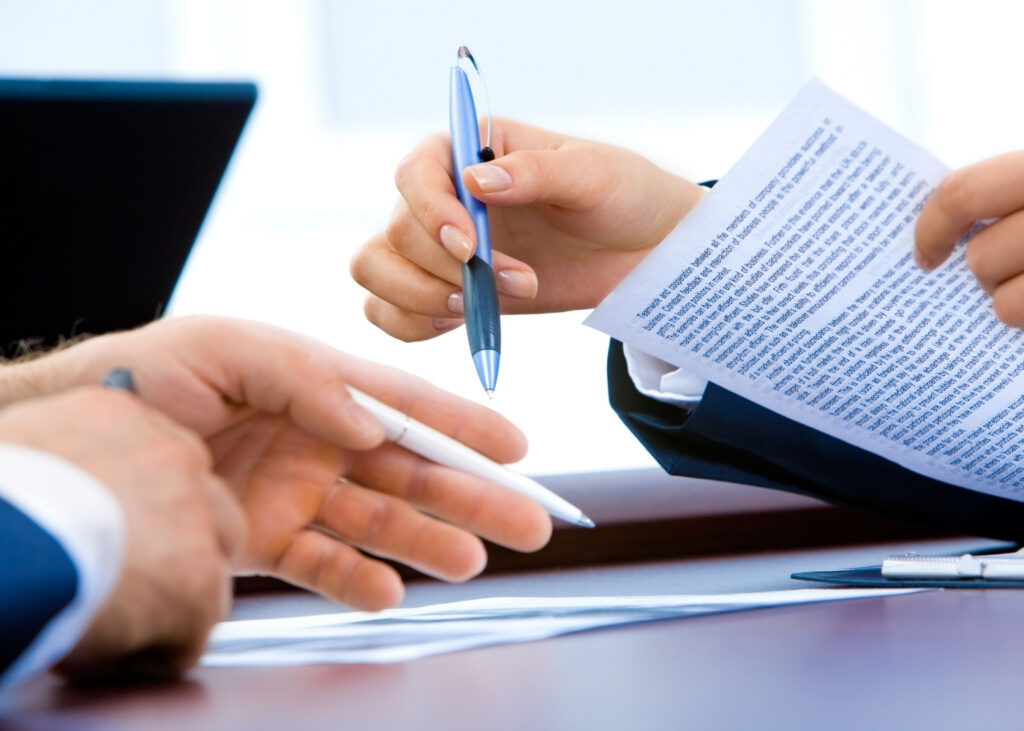 image of contracts signing