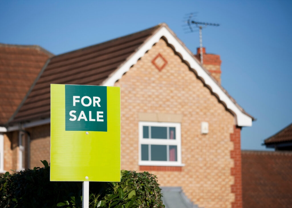 image of house with for sale sign