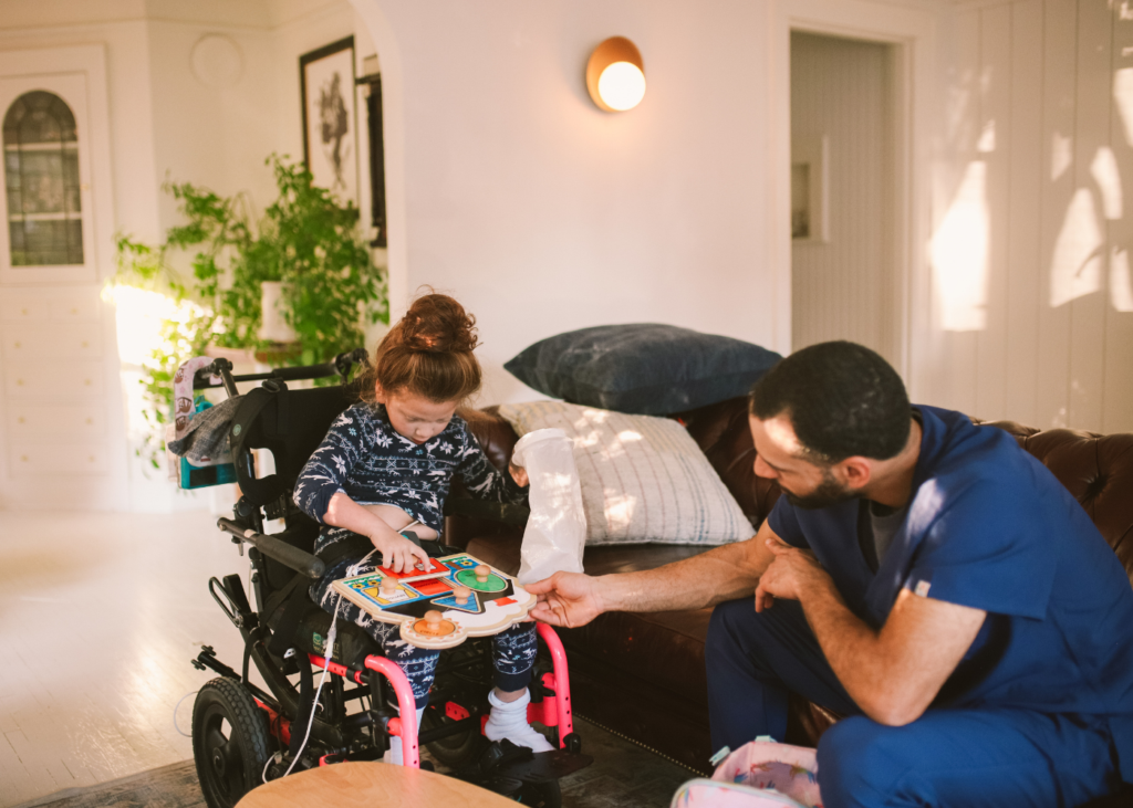 image of medical professional with a child in wheelchair